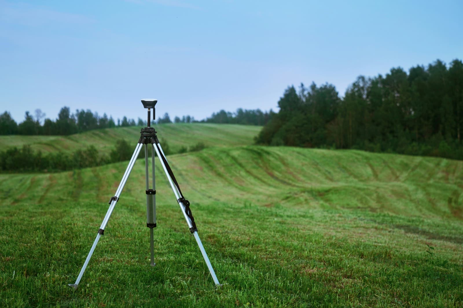 Surveying equipment on land as an illustrative image for land due diligence